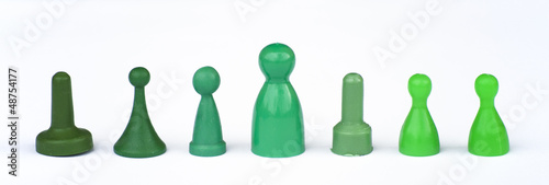 Photo: GREEN MONOPOLY FIGURES ON WHITE BACKGROUND GREEN MONOPOLY FIGURES ON WHITE BACKGROUND