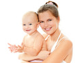 Young mother hugging baby