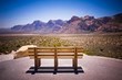 Bench and scenic view of mountain landscape