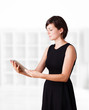 Young woman looking at modern tablet