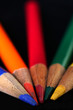 Colored pencils on a black background