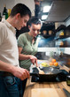 Young couple preparing lunch in kitchen