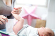 Mother changing a baby's nappy