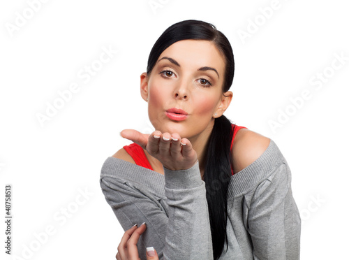 Photo: Young woman sending kiss - isolated Young woman sending kiss - isolated
