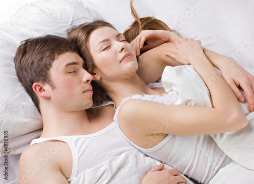 Photo: Young man and woman sleepping Young man and woman sleepping