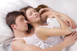 Young man and woman in a bed