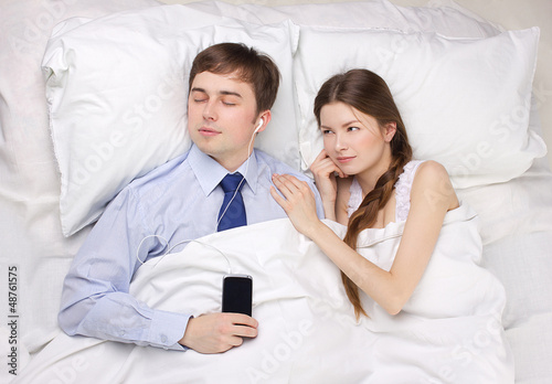 Photo: businessman and woman in bed businessman and woman in bed