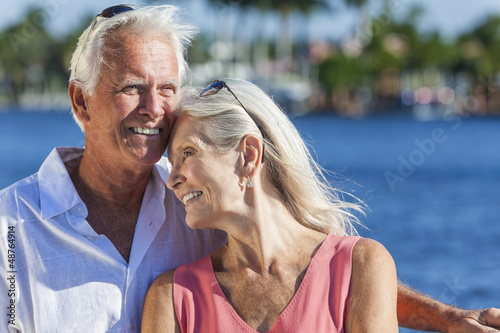 Photo: Happy Senior Couple Walking Tropical Sea or River Happy Senior Couple Walking Tropical Sea or River