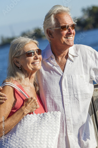 Photo: Happy Senior Couple Walking Tropical Sea or River Happy Senior Couple Walking Tropical Sea or River
