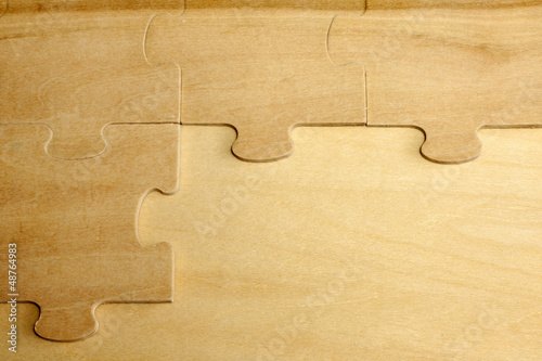 Photo: Puzzle on wooden boards abstract background concept Puzzle on wooden boards abstract background concept