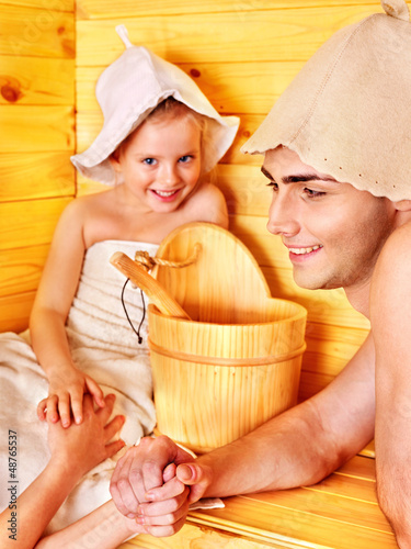 Photo: Family with child relaxing at sauna. Family with child relaxing at sauna.