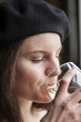 Young Woman Drinking White Wine