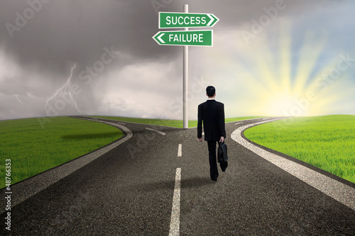 Photo: Businessman choosing path to success Businessman choosing path to success
