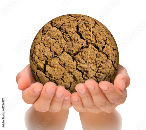Photo: Parched planet in hands, global warming concept, isolated Parched planet in hands, global warming concept, isolated