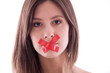 Young woman with red duct tape on her lips