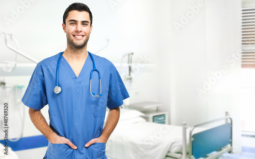 Photo: Handsome doctor in a hospital room Handsome doctor in a hospital room