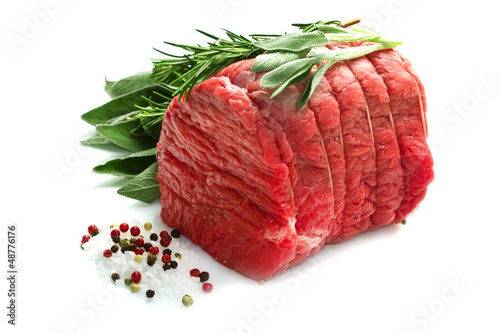 Photo: Raw beef isolated on white Raw beef isolated on white