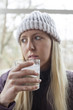 Photo: Young Woman in White Stocking Cap Drinking Water Young Woman in White Stocking Cap Drinking Water