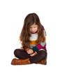 Sad little girl with long hair sitting