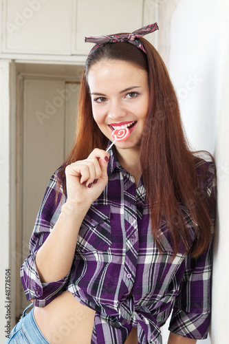 Photo: Pretty woman sucking lollipop Pretty woman sucking lollipop