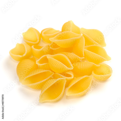 Photo: Conchiglie (Seashell Shaped) Pasta Isolated on White Background Conchiglie (Seashell Shaped) Pasta Isolated on White Background
