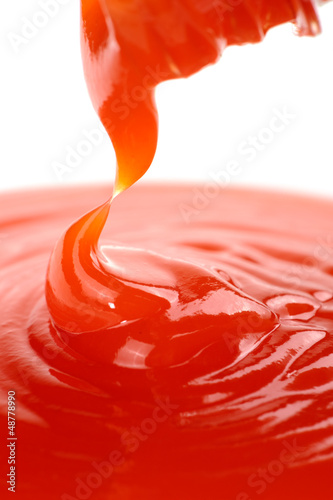 Photo: Hot Chili Sauce Pouring from Bottle Hot Chili Sauce Pouring from Bottle