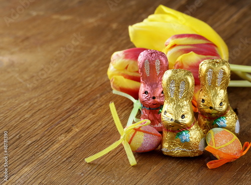 Photo: chocolate Easter bunny (sweets) with tulips chocolate Easter bunny (sweets) with tulips