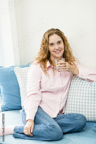 Photo: Woman relaxing at home Woman relaxing at home