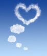 white bubble clouds in blue sky