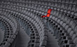 red armchair in grey chair rows