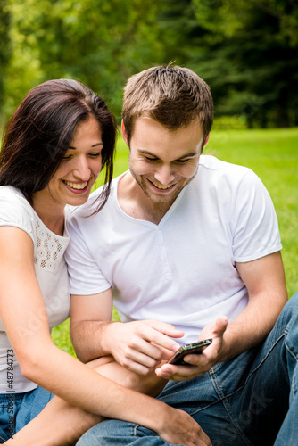 Photo: Young couple with smartphone Young couple with smartphone