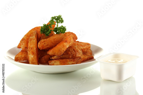 Photo: Appetizing village potatoes on plate isolated on white Appetizing village potatoes on plate isolated on white