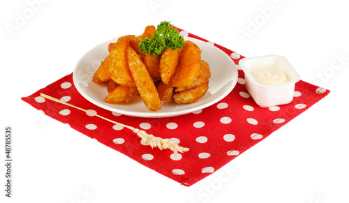 Photo: Appetizing village potatoes on plate isolated on white Appetizing village potatoes on plate isolated on white