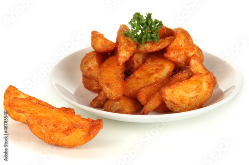 Photo: Appetizing village potatoes on plate isolated on white Appetizing village potatoes on plate isolated on white