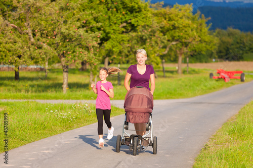 Photo: Family sport - jogging with baby stroller Family sport - jogging with baby stroller