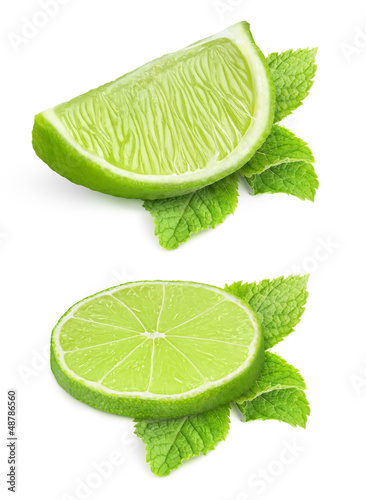 Photo: Pieces of lime isolated on white Pieces of lime isolated on white