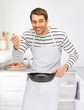 handsome man with pan at kitchen