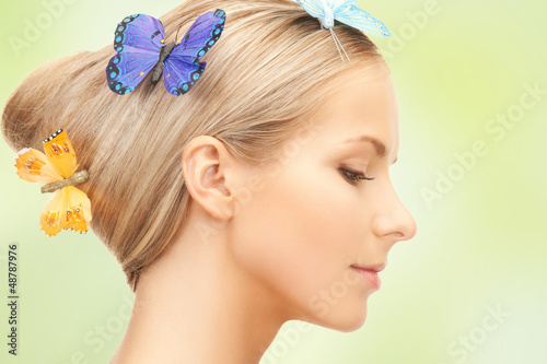 Photo: woman with butterfly in hair woman with butterfly in hair