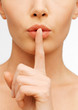 woman making a hush gesture