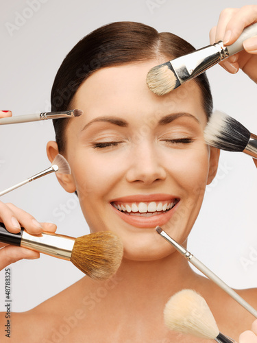 Photo: beautiful woman with brushes beautiful woman with brushes