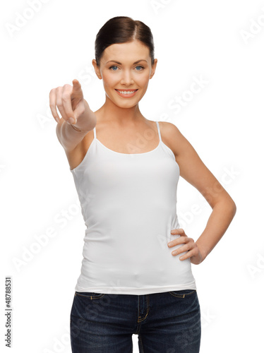 Photo: woman in blank white t-shirt pointing her finger woman in blank white t-shirt pointing her finger