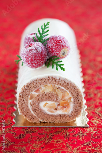 Photo: Swiss roll with cinnamon and apples, selective focus Swiss roll with cinnamon and apples, selective focus
