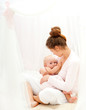 Mother breast feeding her infant
