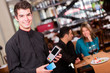 Waiter taking a payment