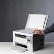 Photo: Man hand making copy. Man hand making copy.