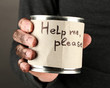 homeless man asks for help, on black background close-up