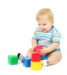 Little boy playing with multicolor blocks