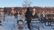 Video: Young woman in cemetery during winter time Young woman in cemetery during winter time