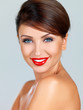 Smiling fashion model in red lipstick