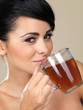 Attractive woman drinking tea